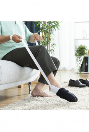 Pagalbinė priemonė kojinėms...